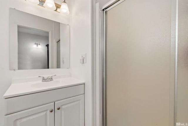 bathroom with vanity and walk in shower