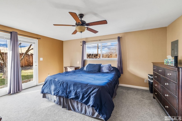 carpeted bedroom with multiple windows, access to outside, and ceiling fan