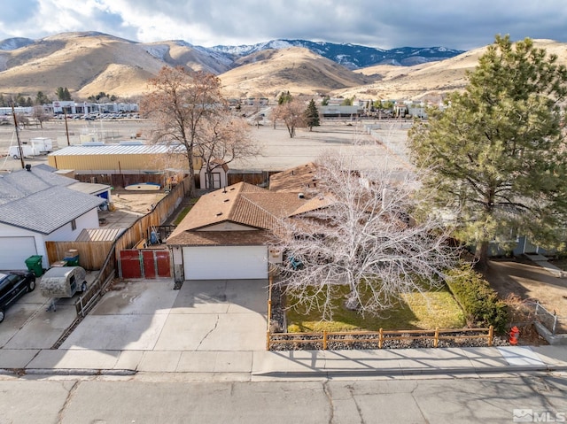 birds eye view of property with a mountain view