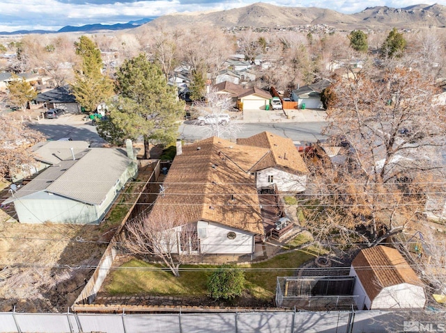 birds eye view of property with a mountain view