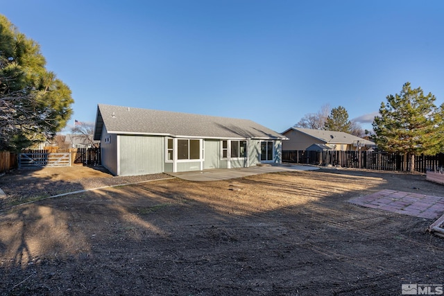 rear view of house with a patio