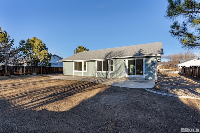 rear view of property featuring a patio area