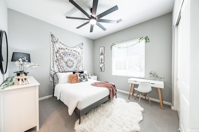 bedroom featuring ceiling fan, a closet, and carpet floors