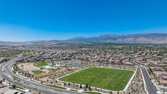 birds eye view of property with a mountain view