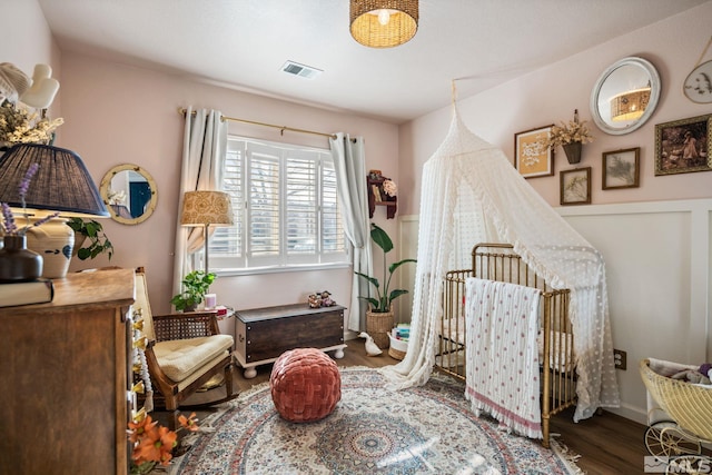 sitting room with hardwood / wood-style flooring