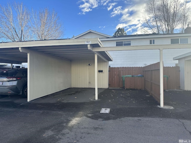 view of vehicle parking featuring a carport