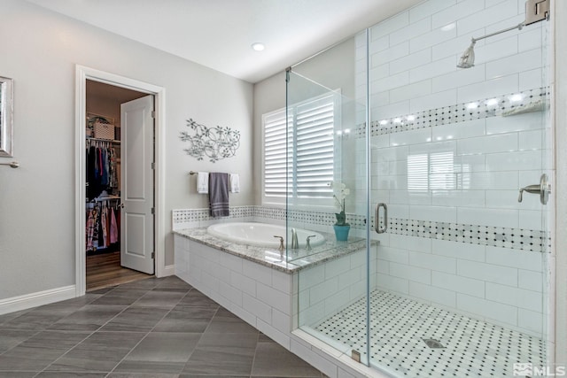 bathroom with tile patterned flooring and independent shower and bath