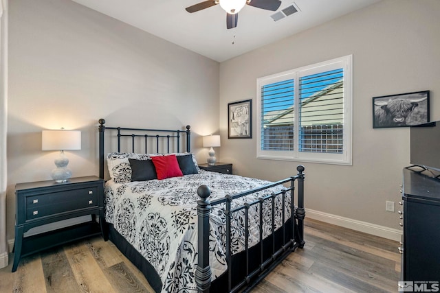 bedroom featuring ceiling fan and hardwood / wood-style floors