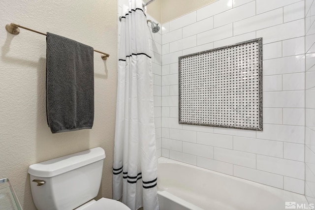 bathroom featuring toilet and shower / tub combo with curtain