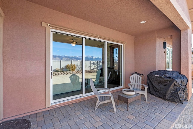 view of patio with a mountain view and grilling area