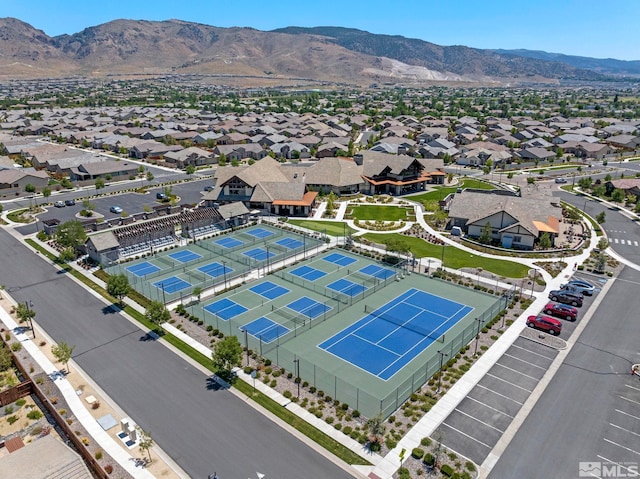 birds eye view of property with a mountain view