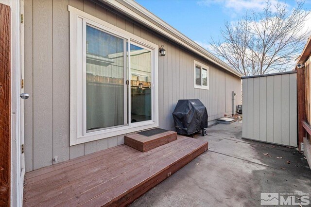 view of patio / terrace with area for grilling and a deck