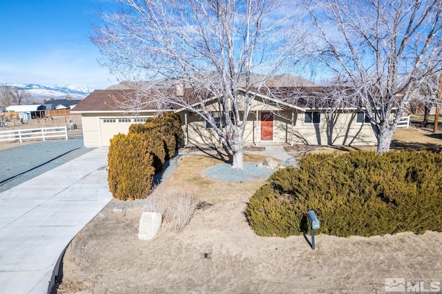 view of front of home featuring a mountain view and a garage