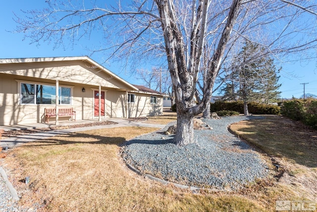 exterior space with a front yard