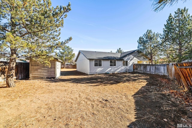 back of property featuring a storage unit