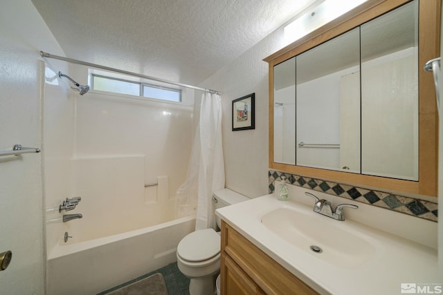 full bathroom featuring vanity, shower / bath combination with curtain, tile patterned flooring, toilet, and a textured ceiling