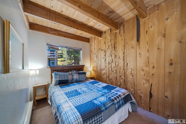 bedroom with beam ceiling, carpet, and wood ceiling