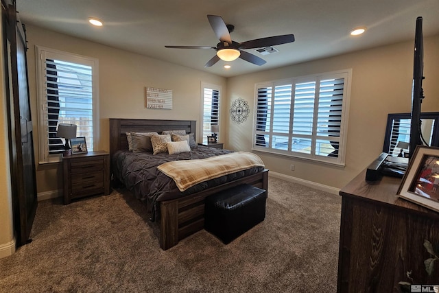 bedroom with dark colored carpet and ceiling fan