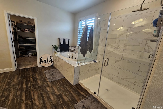 bathroom with separate shower and tub and hardwood / wood-style floors