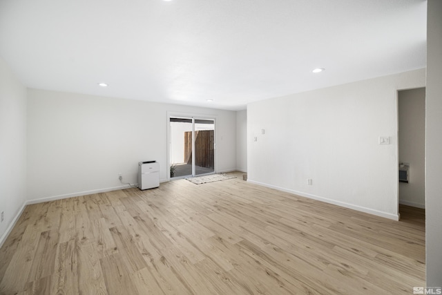 spare room featuring light hardwood / wood-style flooring