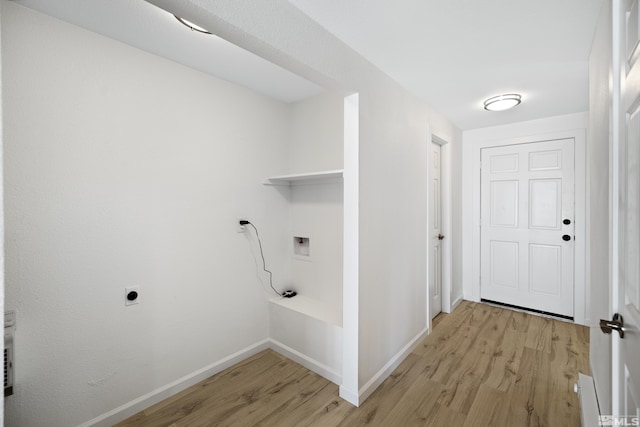 laundry area featuring washer hookup and light hardwood / wood-style flooring