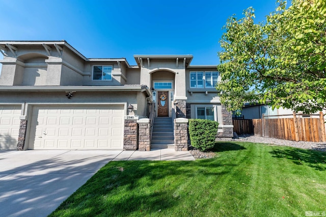 view of front of property featuring a garage and a front lawn