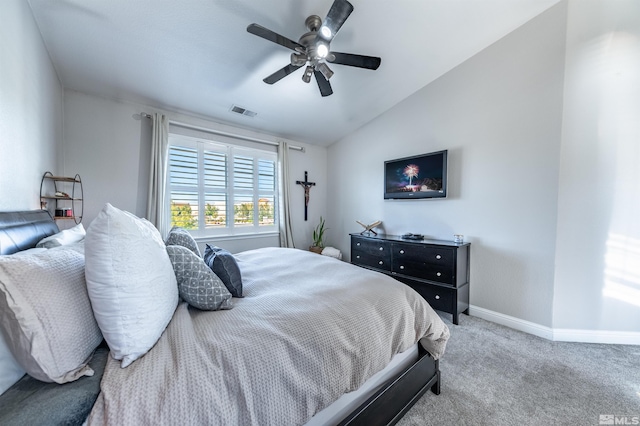 carpeted bedroom featuring ceiling fan and lofted ceiling