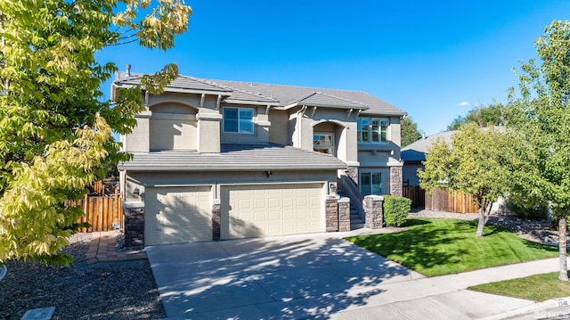 view of front of house featuring a front lawn and a garage