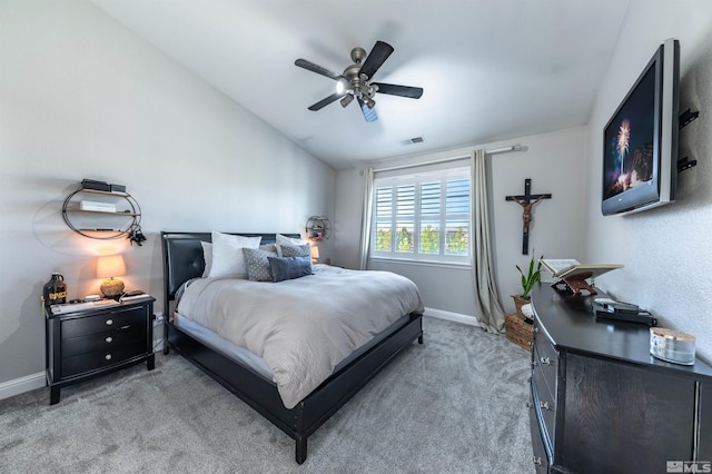 bedroom with ceiling fan, light carpet, and lofted ceiling