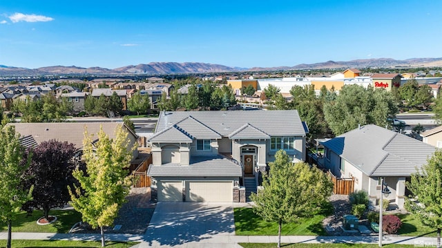 birds eye view of property with a mountain view