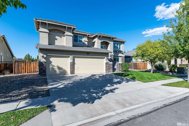 view of front of home featuring a front yard and a garage