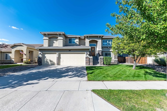 view of front of house featuring a front lawn and a garage