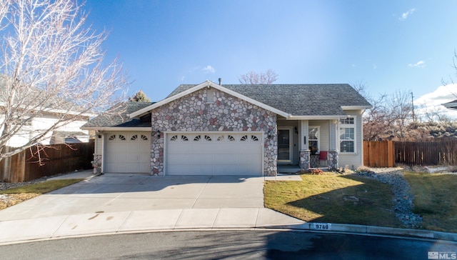 view of front of property with a garage and a front yard