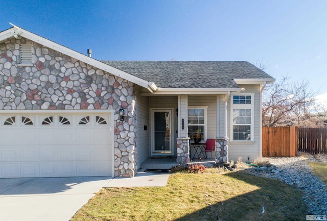 ranch-style house featuring a front yard and a garage