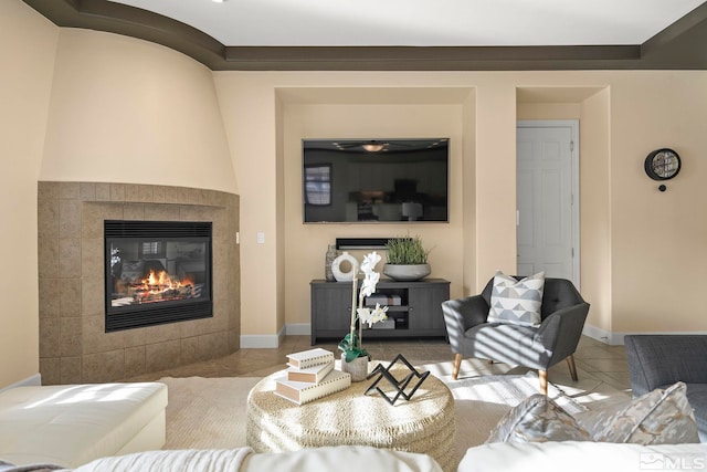 tiled living room featuring a tile fireplace