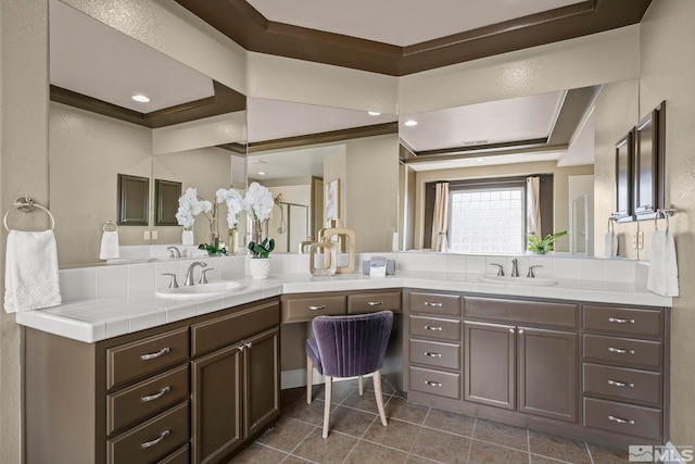 bathroom with vanity, tile patterned floors, and crown molding