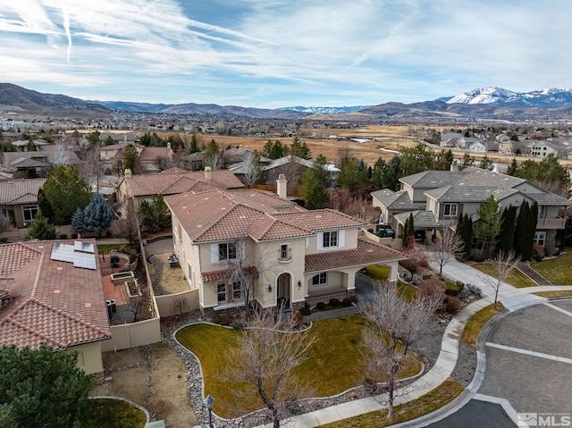 birds eye view of property featuring a mountain view