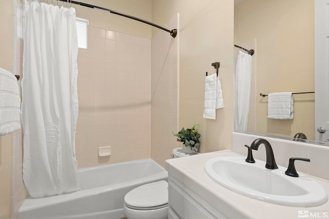 full bathroom featuring shower / bath combo, toilet, and vanity