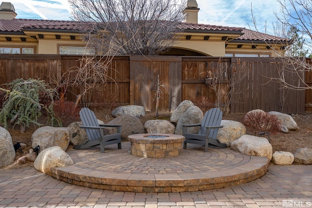 view of patio with an outdoor fire pit