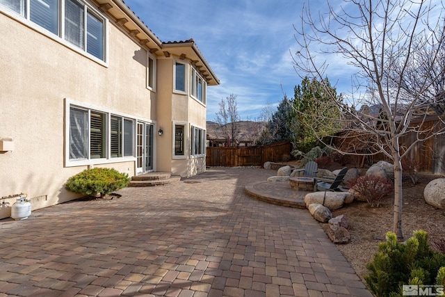 view of patio / terrace featuring a fire pit