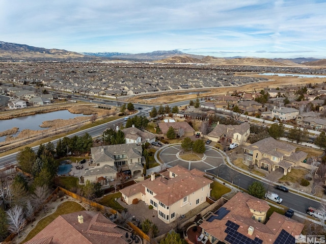 birds eye view of property featuring a water and mountain view