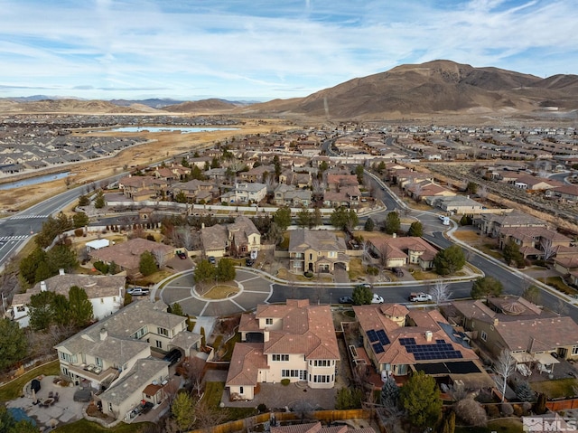 birds eye view of property with a mountain view