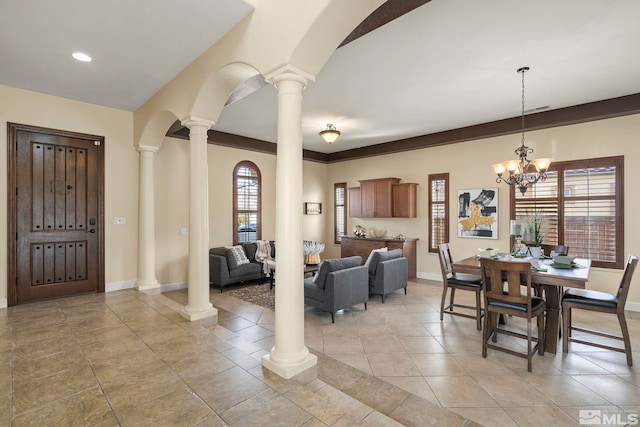 dining space featuring a notable chandelier