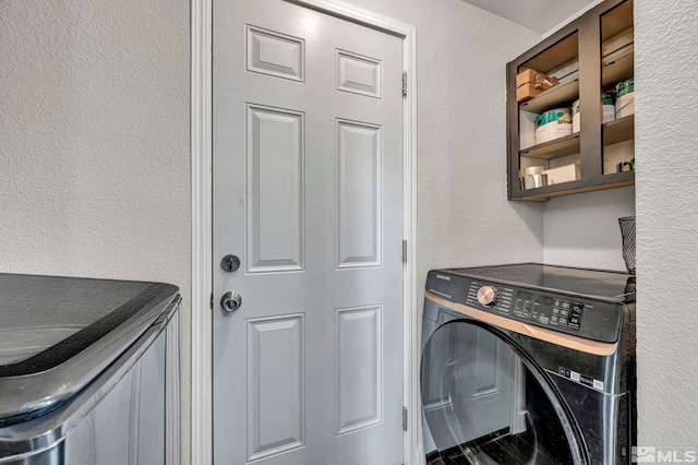 laundry room with washer / dryer