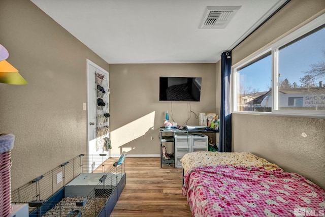 bedroom featuring hardwood / wood-style floors