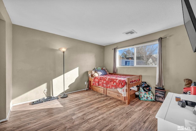 bedroom featuring light hardwood / wood-style floors