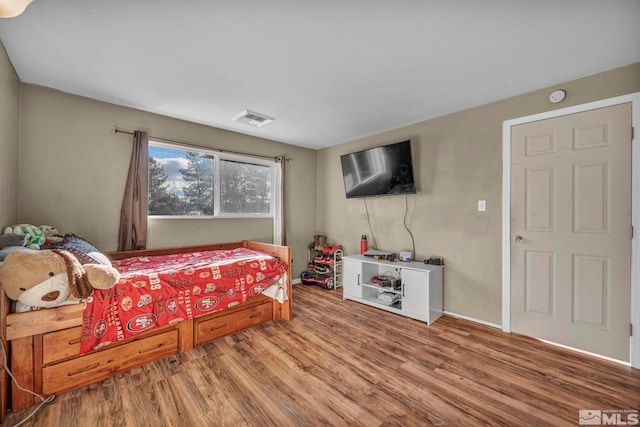 bedroom featuring hardwood / wood-style floors