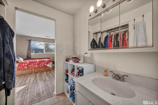 bathroom featuring tile patterned floors and vanity