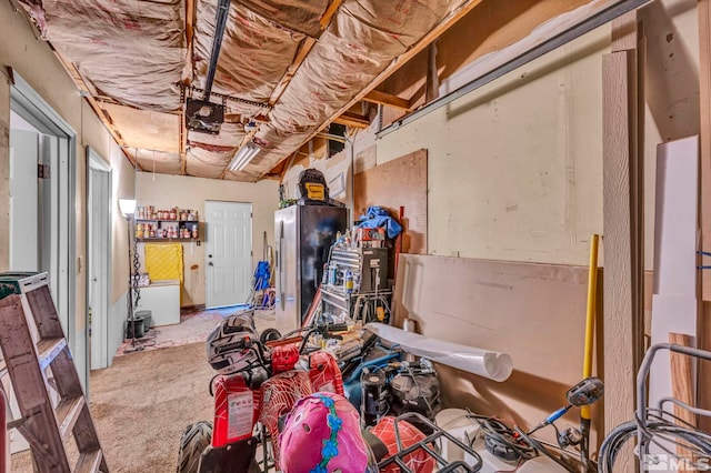 interior space with stainless steel fridge and carpet floors