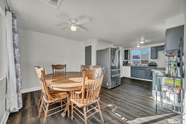 dining space featuring dark hardwood / wood-style floors and ceiling fan